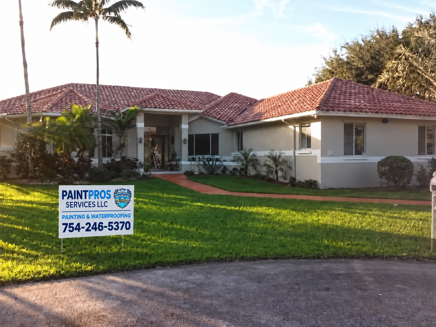 Same single-story patio exterior after painting with the approved PaintPros yard sign